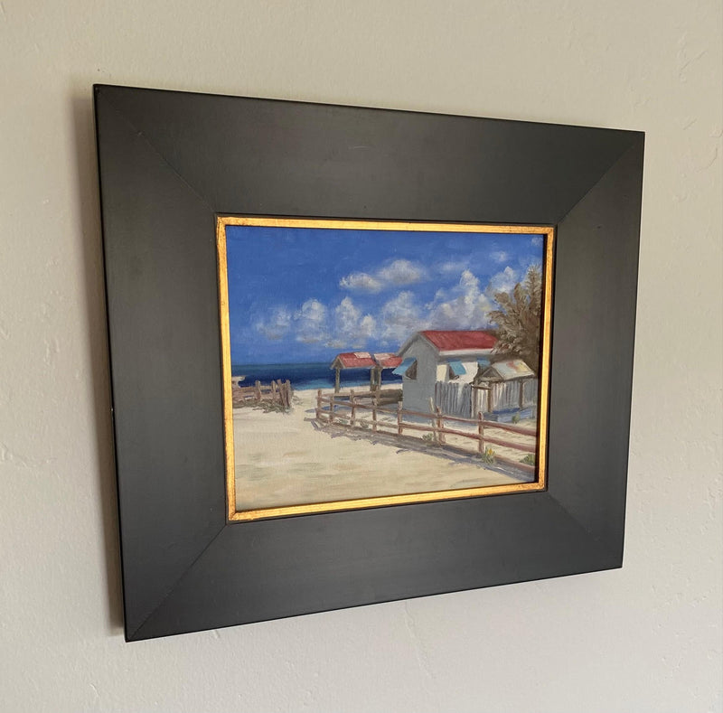 Image of giclee print of an original oil painting of a beach and structure in the Turks and Caicos by Steve Sandborg Art.  Shown in optional frame. 