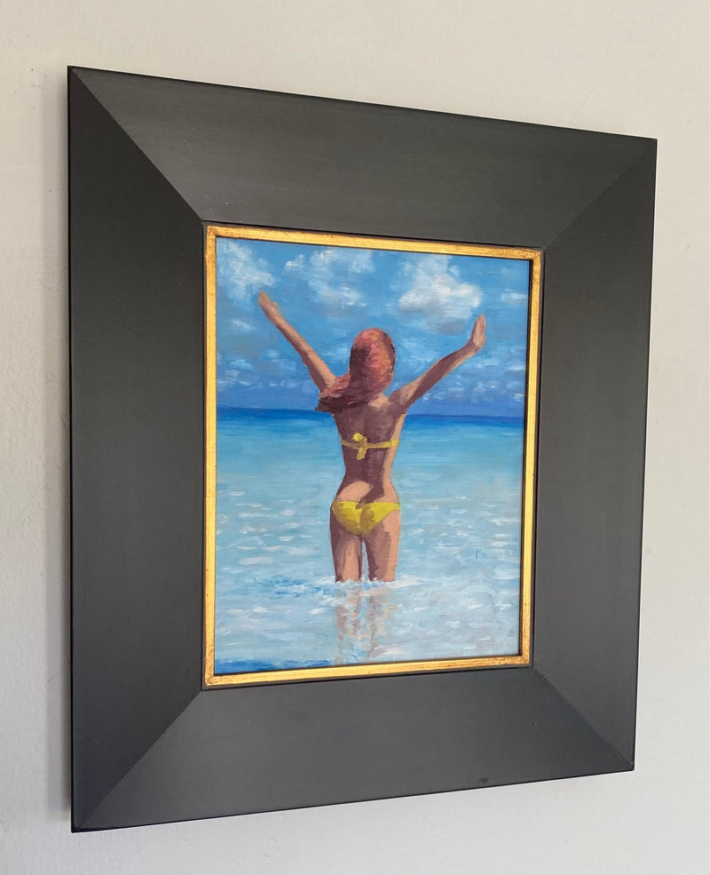Image of a girl feeling happy to be in the tropical ocean by Steve Sandborg Art. Shown in optional frame. 